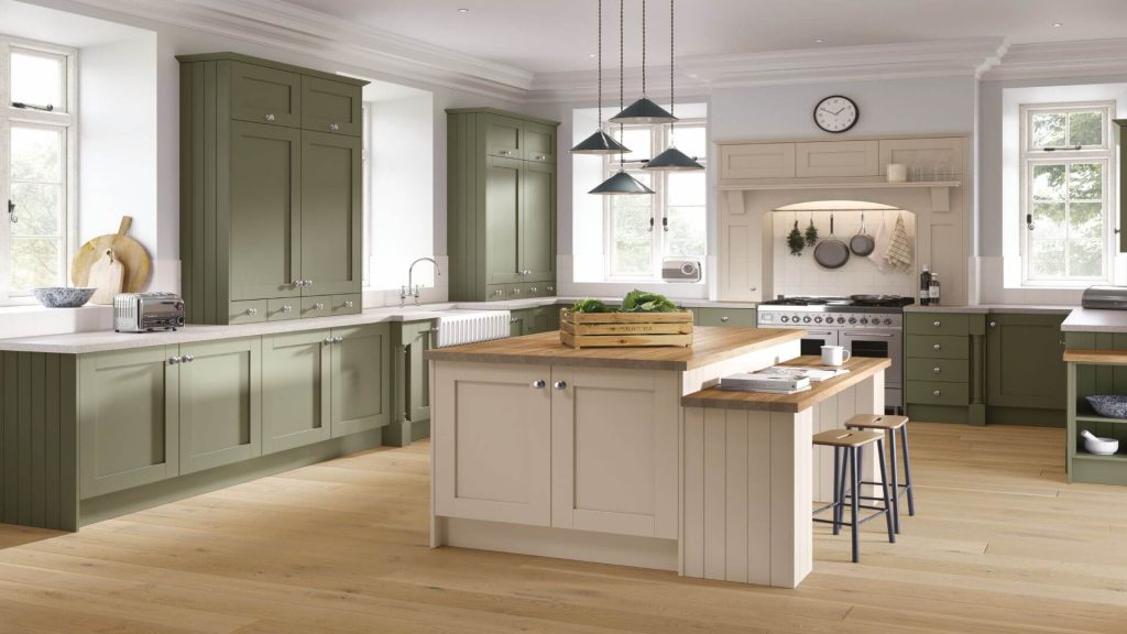 Classic shaker kitchen doors in sage green and cashmere with island seating and timber worktops